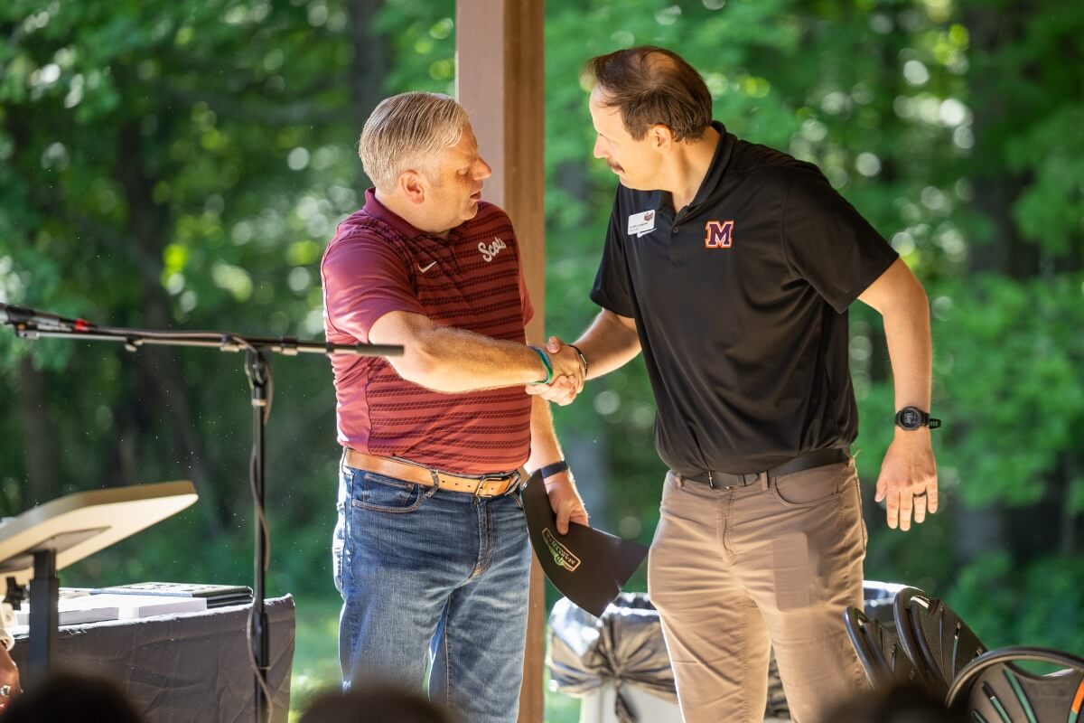 Photo of two men shaking hands