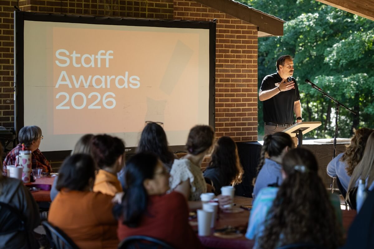 Photo of a screen that says "Staff Awards"