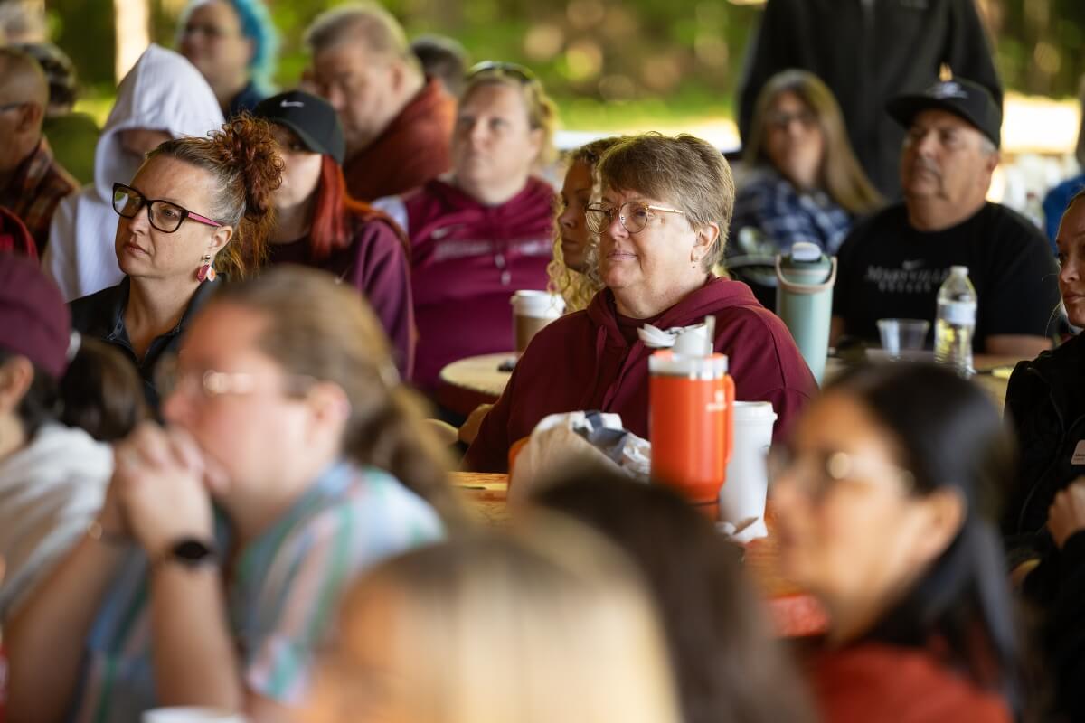 Photo of people facing the left side of the screen